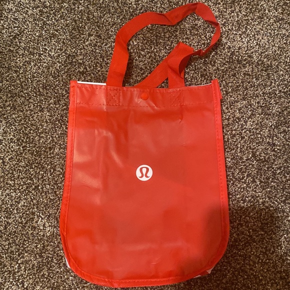 Red lululemon bag and three tags - Picture 2 of 3